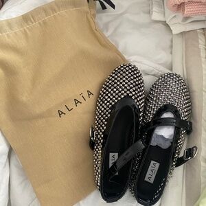 Alaia black studded flats